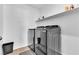 Laundry room features a modern washer and dryer set with storage shelf at 10415 Sadie Blake Ave, Las Vegas, NV 89166