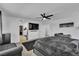 Main bedroom with accent wall, walk-in closet, and large TV at 10415 Sadie Blake Ave, Las Vegas, NV 89166