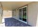 Covered patio with brick flooring and sliding glass doors at 10415 Sadie Blake Ave, Las Vegas, NV 89166