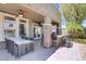 This covered patio area with a grill and outdoor dining is an entertainer's dream at 10520 Maystar Ln, Las Vegas, NV 89135