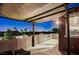 Balcony with awning, offering nice neighborhood views at dusk under subtle lighting at 10520 Maystar Ln, Las Vegas, NV 89135