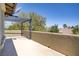 Spacious balcony features an overhead pergola and partial mountain views at 10520 Maystar Ln, Las Vegas, NV 89135