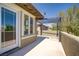 Spacious balcony features an overhead pergola and views of the yard at 10520 Maystar Ln, Las Vegas, NV 89135