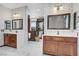 Elegant bathroom with dual vanities, subway tile, and access to a spacious walk-in closet at 10520 Maystar Ln, Las Vegas, NV 89135