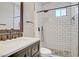Stylish bathroom featuring white subway tile, a glass-enclosed shower, and modern fixtures at 10520 Maystar Ln, Las Vegas, NV 89135