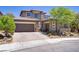Charming two-story home with a two-car garage and lovely brick driveway at 10520 Maystar Ln, Las Vegas, NV 89135