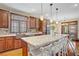 Beautiful kitchen features an island with counter seating and plenty of cabinet space at 10520 Maystar Ln, Las Vegas, NV 89135