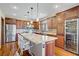 Gourmet kitchen with stainless steel appliances, custom cabinets, and a large island perfect for entertaining at 10520 Maystar Ln, Las Vegas, NV 89135
