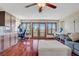 Inviting living room with hardwood floors, ample natural light, and a cozy seating area at 10520 Maystar Ln, Las Vegas, NV 89135