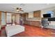 Spacious living room features built-in cabinetry and wood floors at 10520 Maystar Ln, Las Vegas, NV 89135