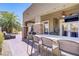 Extended counter bar and multiple seating options highlight this relaxing outdoor space at 10520 Maystar Ln, Las Vegas, NV 89135