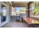 Outdoor kitchen with bar-top dining, grill, built-in shelves, and a stone column accent at 10520 Maystar Ln, Las Vegas, NV 89135