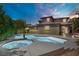 Backyard oasis featuring a stunning pool with a spa, perfect for relaxation and entertaining at 10520 Maystar Ln, Las Vegas, NV 89135
