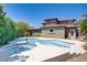 Backyard pool and spa area with a spacious patio, perfect for outdoor entertaining and relaxation at 10520 Maystar Ln, Las Vegas, NV 89135