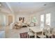 Open-concept design showcasing a bright living room adjacent to the dining area, great for entertaining guests at 10573 Bambola Pl, Las Vegas, NV 89135