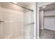 Shower featuring tiled walls, glass doors, and new fixtures at 1201 Seaboard Ct, Henderson, NV 89002
