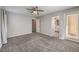Open bedroom with neutral carpet, ceiling fan and a ensuite bathroom at 1201 Seaboard Ct, Henderson, NV 89002