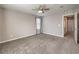 Large bedroom with neutral carpet, a ceiling fan and a window at 1201 Seaboard Ct, Henderson, NV 89002