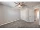 A bedroom showing a ceiling fan, closet, and door to the hallway at 1201 Seaboard Ct, Henderson, NV 89002