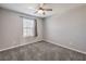 Bedroom showcasing neutral walls, carpet floors, a ceiling fan, and natural lighting at 1201 Seaboard Ct, Henderson, NV 89002