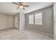 Serene bedroom featuring tile floors, neutral walls, and a ceiling fan for comfort at 1201 Seaboard Ct, Henderson, NV 89002