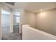 Upstairs hallway with carpet floors and access to bedrooms at 1201 Seaboard Ct, Henderson, NV 89002