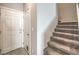Entry hallway with staircase and access to the garage at 1201 Seaboard Ct, Henderson, NV 89002