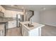 Modern kitchen with island, stainless steel appliances, and ample cabinet space at 1201 Seaboard Ct, Henderson, NV 89002