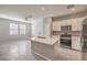 Open kitchen boasts a large island and stainless steel appliances at 1201 Seaboard Ct, Henderson, NV 89002