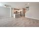Spacious open-plan living space with sleek tile flooring connecting to a well-equipped kitchen at 1201 Seaboard Ct, Henderson, NV 89002