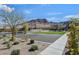 Community playground with swings, benches, desert landscaping, and mountain views at 1201 Seaboard Ct, Henderson, NV 89002