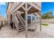 Outdoor patio featuring a second-story deck, grill, and artificial turf, ideal for relaxation and entertaining at 140 Rolling Cove Ave, Henderson, NV 89011
