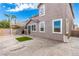 Spacious backyard with patio, second story deck, and artificial turf, perfect for outdoor gatherings at 140 Rolling Cove Ave, Henderson, NV 89011