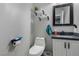 Half bath features white vanity, granite countertop, and modern fixtures at 140 Rolling Cove Ave, Henderson, NV 89011