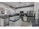Beautiful kitchen featuring stainless steel appliances and granite countertops with an island at 140 Rolling Cove Ave, Henderson, NV 89011