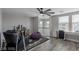 Open loft area with wood floors, large windows and ceiling fan offers flexible living space at 140 Rolling Cove Ave, Henderson, NV 89011