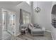 Bright sitting area with a modern light fixture, comfortable seating, and durable, wood-look flooring at 140 Rolling Cove Ave, Henderson, NV 89011