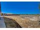 Spacious backyard, ideal for creating your own outdoor oasis, offering privacy with block wall and fence at 1420 Logandale Dr, Logandale, NV 89021
