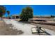 Long driveway leads to back garage with large trees and room to park cars and trucks at 1420 Logandale Dr, Logandale, NV 89021