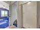 Bathroom with glass shower enclosure seen from bedroom doorway at 1420 Logandale Dr, Logandale, NV 89021