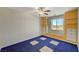 Bedroom featuring a ceiling fan and built in storage and window at 1420 Logandale Dr, Logandale, NV 89021