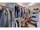 Spacious walk-in closet with shelving, hanging rods, and organized storage for clothing and accessories at 1420 Logandale Dr, Logandale, NV 89021