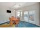 A dining area features a wood table and chairs and sliding glass doors to the exterior at 1420 Logandale Dr, Logandale, NV 89021