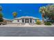 Inviting single-story home featuring desert landscaping, mature trees, and a welcoming entrance at 1420 Logandale Dr, Logandale, NV 89021