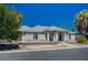 Attractive single-story home with desert landscaping and mature palm trees in front yard at 1420 Logandale Dr, Logandale, NV 89021