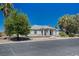 Front exterior of a single story home with professional landscaping and mature trees at 1420 Logandale Dr, Logandale, NV 89021
