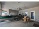 Enclosed back patio with boat parked inside and bar with barstools at 1420 Logandale Dr, Logandale, NV 89021
