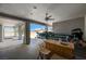 Covered patio with a ceiling fan and view to backyard with boat parked near bar at 1420 Logandale Dr, Logandale, NV 89021
