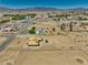 Expansive aerial view of new construction home, showcasing the surrounding community and mountain backdrop at 1550 W Jornada St, Pahrump, NV 89048
