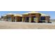 Exterior view of a home under construction, showing framing and window installation progress at 1550 W Jornada St, Pahrump, NV 89048